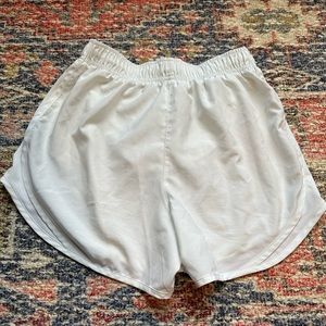 White Nike running shorts